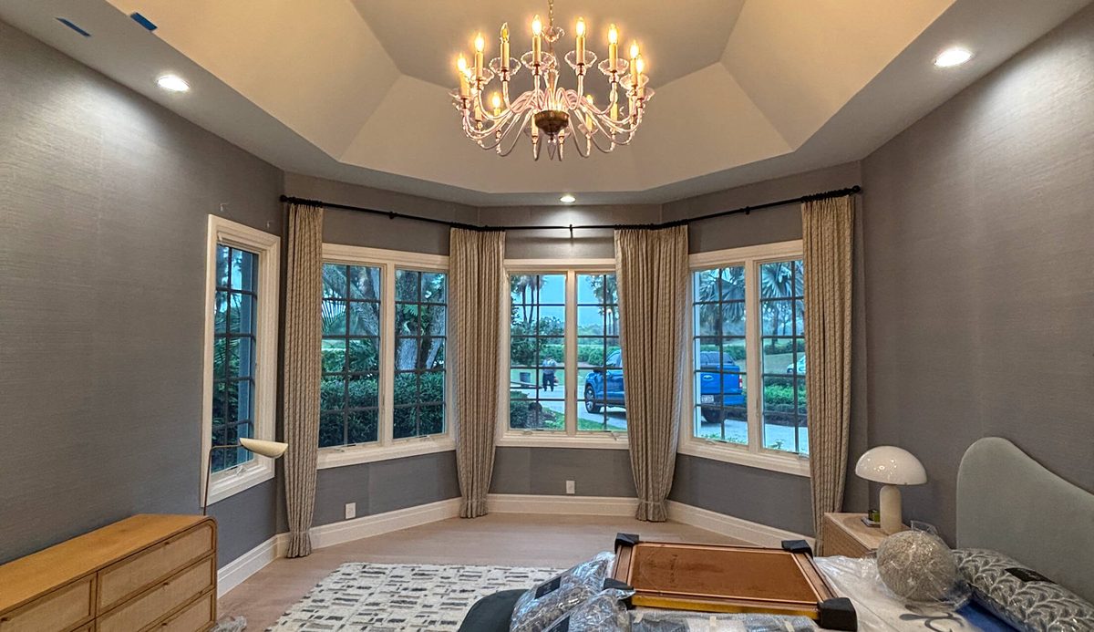 Chandelier and recessed lighting installed in a bedroom by Eastern Electric Solutions